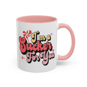 I'm a Sucker for You, Valentine's Day Lollipop Mug - Available in a variety of vibrant accent colors, and in 15oz and 11oz sizes. Dishwasher and microwave safe.